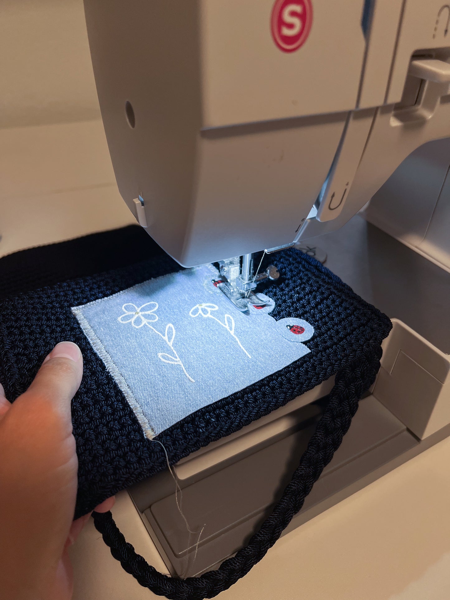 Reworked hand-painted flowers and ladybugs appliqué The Sack bag