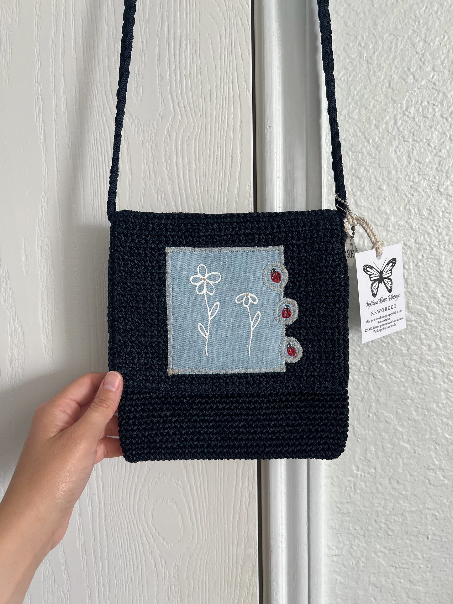 Reworked hand-painted flowers and ladybugs appliqué The Sack bag