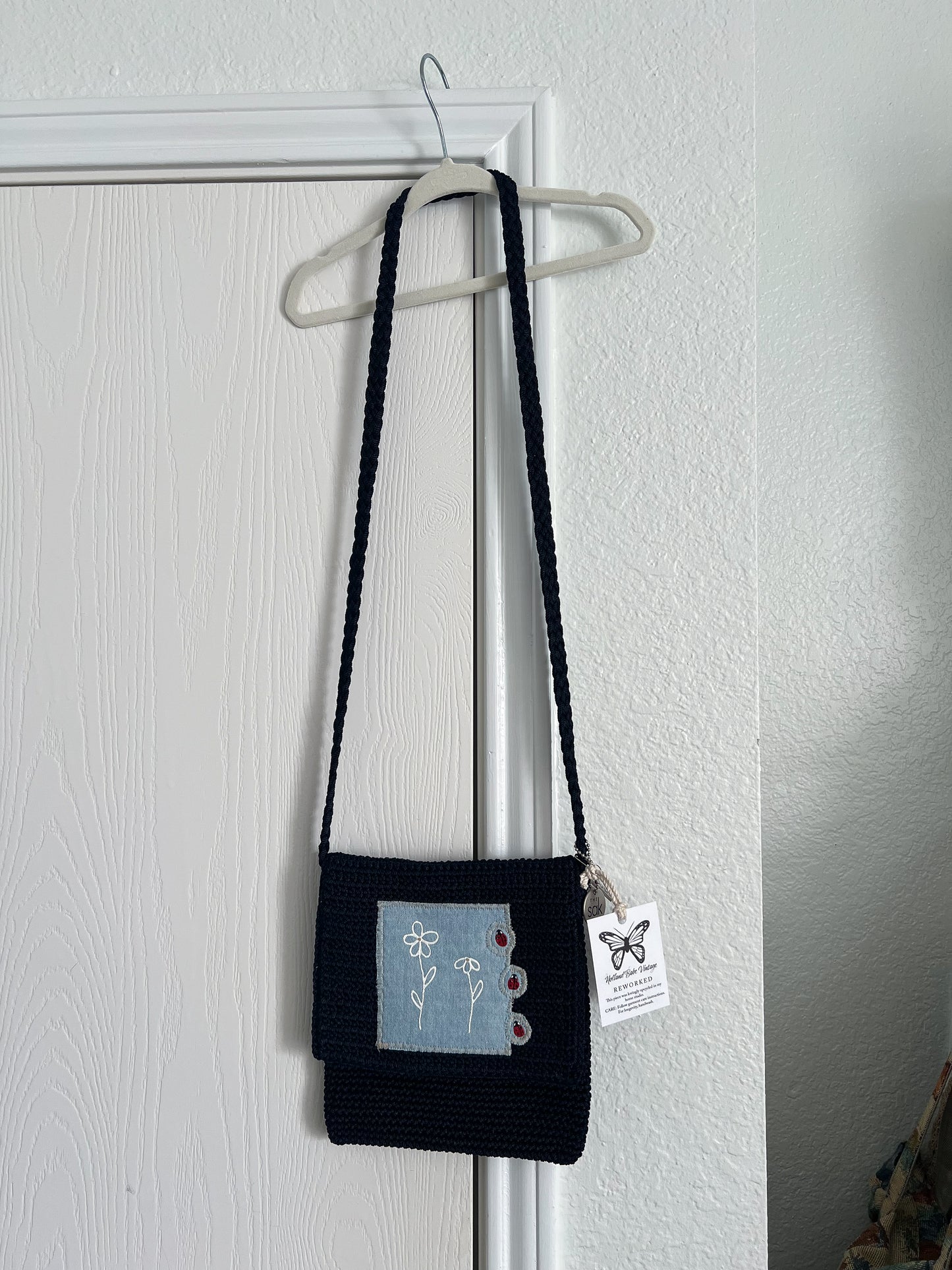 Reworked hand-painted flowers and ladybugs appliqué The Sack bag